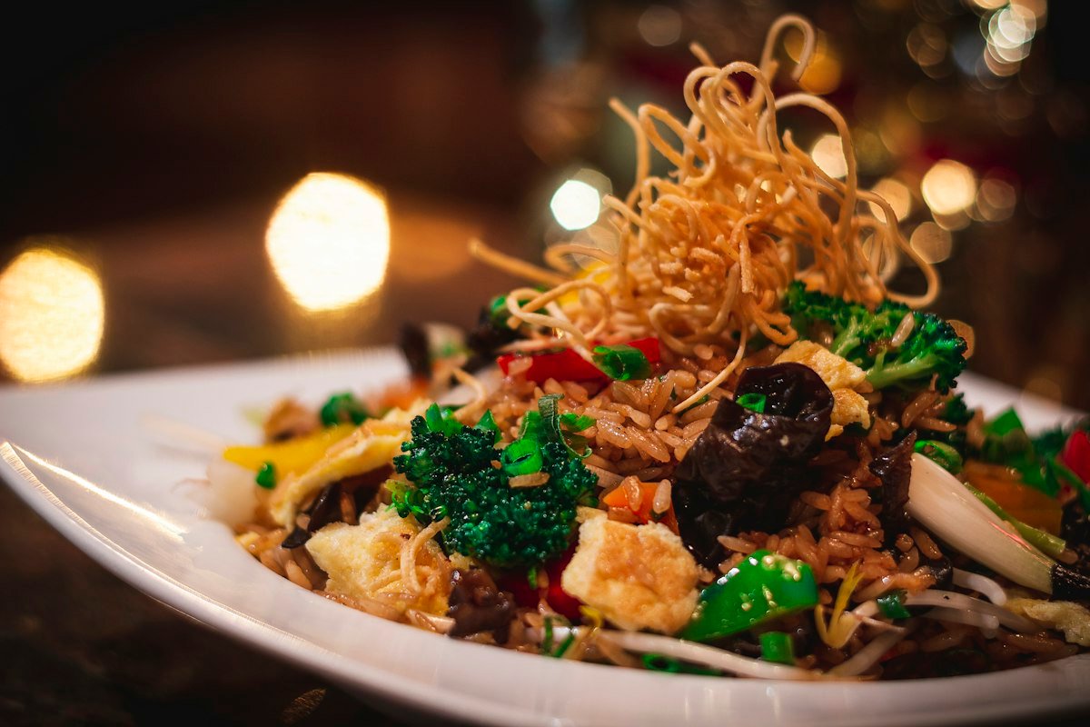 Placeholder hero image: a freshly prepared biryani served hot, styled for a premium multicuisine restaurant