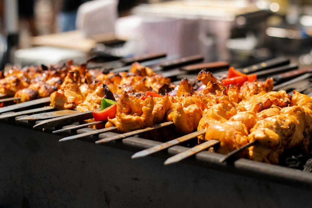 Placeholder image: skewers of chicken and vegetables cooking over a hot grill